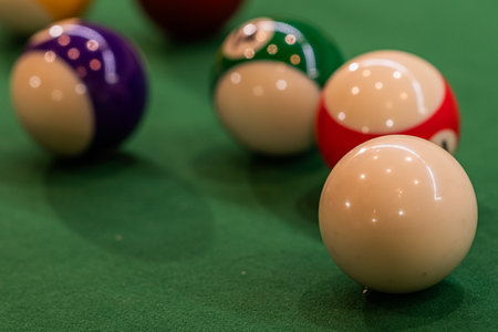 Colorful pool balls arranged on a billiard table, promising entertainment and friendly competitionの写真素材
