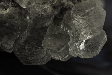Cluster of translucent gray celestine crystals with natural rough matrix
