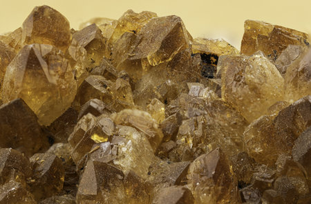 Close-up of golden brown crystal cluster showing sharp terminations and natural luster, ideal for collectors, decorators, and geology enthusiastsの写真素材