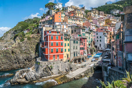 The beautiful Riomaggiore in Cinque Terre with many colorful housesの写真素材