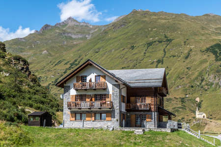 small village in the mountains with stone houses, flowers and a river in val formazzaのeditorial素材