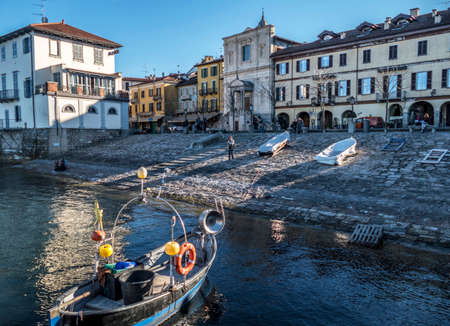 Arona, Italy - 10/22/2017: the old port of Arona with colored boatのeditorial素材