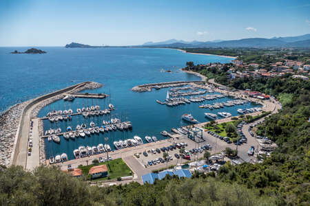 The port and the coast of Santa Maria Navarrese in Sardiniaの写真素材