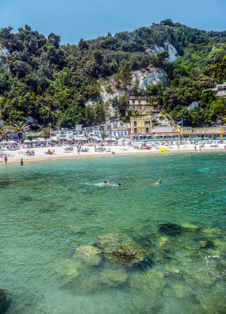 The beautiful Urbani Beach in Sirolo, with green waterの写真素材