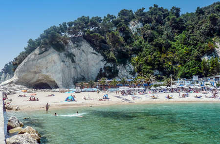 Sirolo, Italy - 07-04-2015: The beautiful Urbani Beach in Sirolo, with green waterのeditorial素材