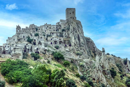 landscape of the ghost town of Craco, with abandoned houses in ruins due to a landslideの写真素材