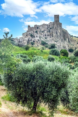 landscape of the ghost town of Craco, with abandoned houses in ruins due to a landslideの写真素材