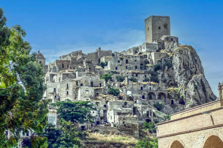 landscape of the ghost town of Craco, with abandoned houses in ruins due to a landslideの写真素材