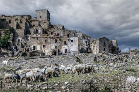 landscape of the ghost town of Craco, with abandoned houses in ruins due to a landslideの写真素材