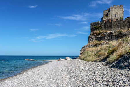 The beach of Roseto Capo Spulico with the green sea and the castle that overlooks itのeditorial素材