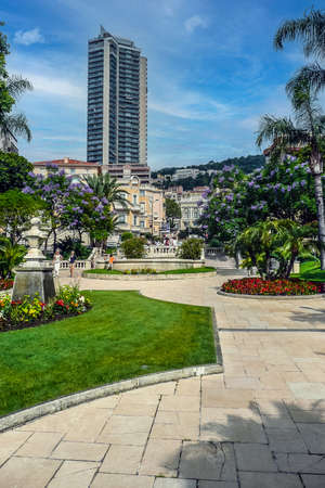 Monaco, France - 07-02-2011: Beautiful Gardens in Monaco with the Casino in the background