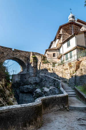 The stone bridge over the Bellano ravineの写真素材