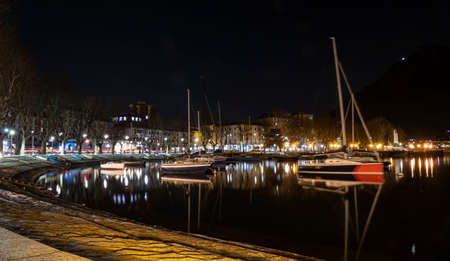 the long lake of Lecco illuminated at nightの写真素材