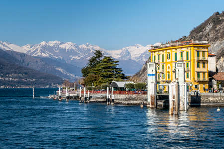 Varenna, Italy - 03-01-2021: The Varenna pier with the snow-capped alps in the backgroundのeditorial素材