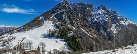 Mount Resegone with snow and a blue skyの写真素材