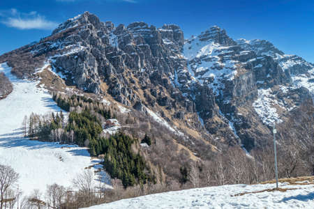 Mount Resegone with snow and a blue skyの写真素材