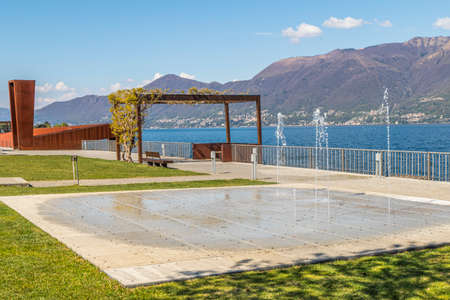 The beautiful park at the lake of Luino with the fountainsの写真素材