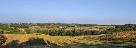 Extra wide view of the Tuscan hills with Siena in the backgroundの写真素材