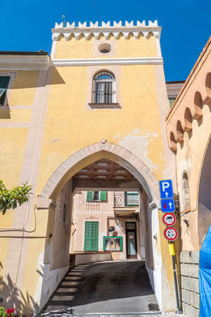 Diano Castello, Italy - 07-07-2021: The entrance arch to the historic center of Diano Castelloのeditorial素材