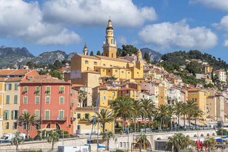 Menton, France - 07-07-2021: The historic center of Menton with the beautiful Basilica and colorful housesのeditorial素材