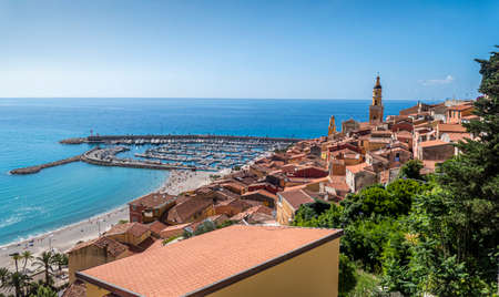 aerial view of the historic center of Menton with the beautiful Basilica and blue seaの写真素材