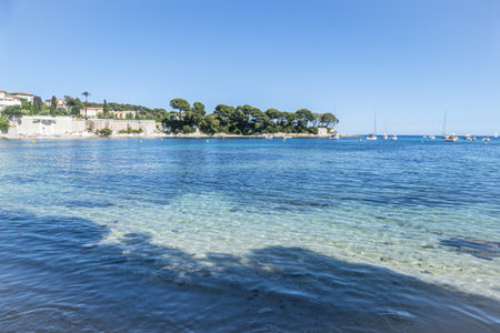 the beautiful Fosses Beach in Saint Jean Cap Ferrat with tropical colored waterの写真素材