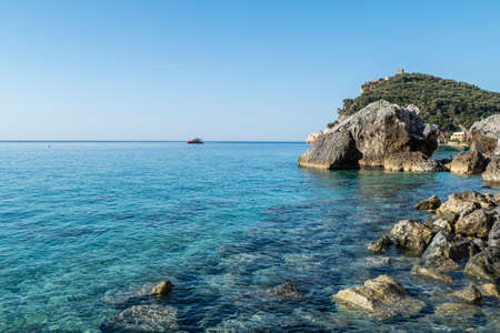 The beautiful beach of Malpasso in Varigotti with transparent and turquoise waterの写真素材