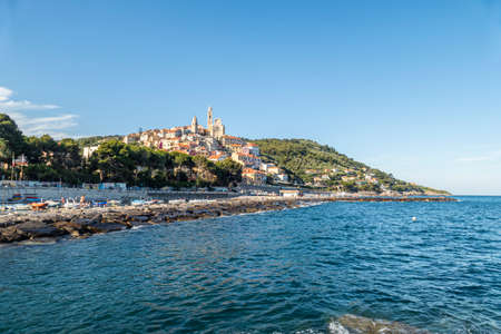 Cervo, Italy - 04-07-2021: Cervo beach with its characteristic rocks and the beautiful town in the backgroundのeditorial素材