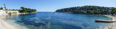 Extra wide Aerial view of the beautiful Fosses Beach in Saint Jean Cap Ferrat with tropical colored waterのeditorial素材