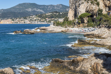 The beautiful Balzi Rossi beach in Ventimiglia with Menton in the backgroundの写真素材
