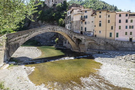 Dolceacqua, Italy - 06-07-2021: The beautiful Roman stone bridge in Dolceacquaのeditorial素材