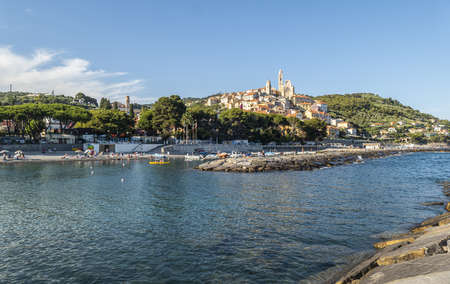 Cervo, Italy - 04-07-2021: Cervo beach with its characteristic rocks and the beautiful town in the backgroundのeditorial素材