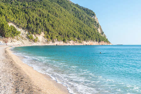 The beautiful beach of San Michele in Sirolo with blue waterの写真素材