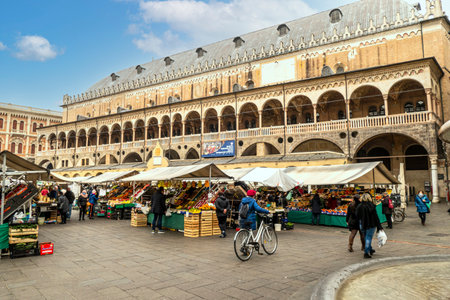 Padova, Italy - 03-05-2022: Piazza delle Erbe with the historic Padua market and the splendid Palazzo della Regione in the backgroundのeditorial素材