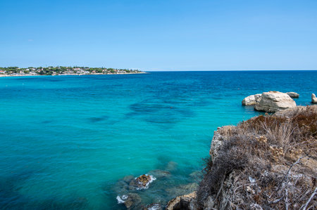 Landscape of a beautiful beach with clear and crystalline turquoise water and fine sand in Sicily in Syracuse called Fontane Biancheの写真素材
