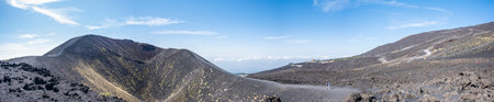 Extra wide angle view of the Etna volcano with its craters, lava and lunar landscapeの写真素材
