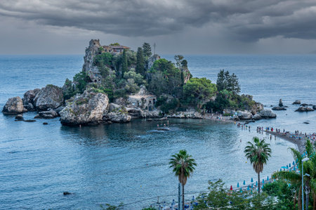 Taormina, Italy: 09-16-2022: The beautiful Isola Bella in Taormina before a stormのeditorial素材