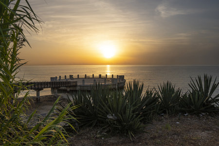 the roundabout overlooking the sea and the beach of Avola with the splendid colors of sunriseの写真素材