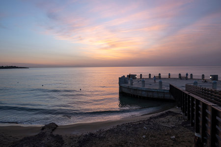 the roundabout overlooking the sea and the beach of Avola with the splendid colors of sunriseの写真素材