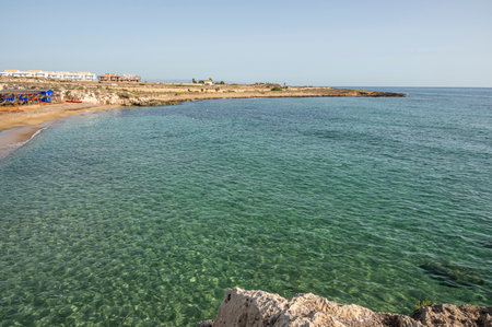 Beach with sand and blue and transparent water called Cravettone or Calafarina in Pachinoの写真素材