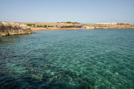 Beach with sand and blue and transparent water called Cravettone or Calafarina in Pachinoの写真素材