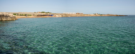 Beach with sand and blue and transparent water called Cravettone or Calafarina in Pachinoの写真素材