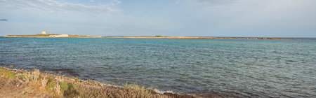 Beach with sand and blue and transparent water called Cravettone or Calafarina in Pachinoの写真素材