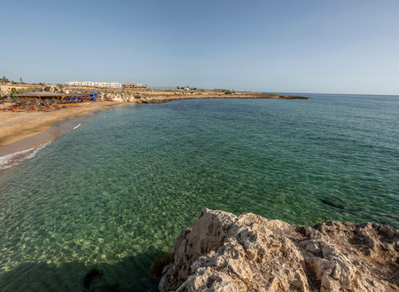 Beach with sand and blue and transparent water called Cravettone or Calafarina in Pachinoの写真素材