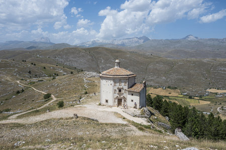 The church of Santa Maria della PietÃ  in Rocca Calascio with the beautiful Abruzzo mountains and hills in the backgroundのeditorial素材