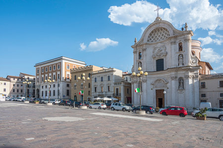 L'Aquila, Italy - 07-07-2022: The beautiful Piazza Duomo in L'Aquila with historic buildings and churchesのeditorial素材
