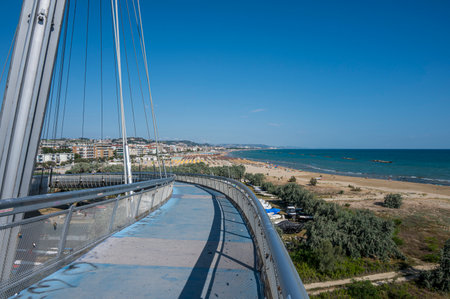 Pescara, Italy - 07-08-2022: Panorama of the beach of Pescara with Montesilvano in backgroud from the bridge of the seaのeditorial素材