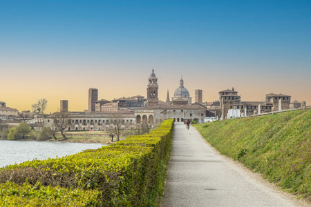 The famous cityscape of Mantua from the bridge over the Mincio at sunsetのeditorial素材