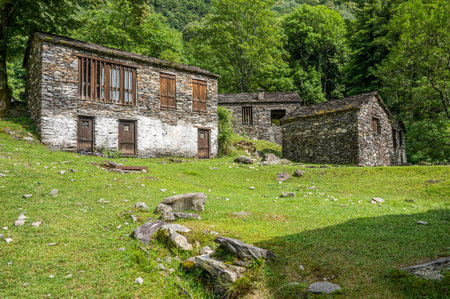 Ruined stone houses and mills in an abandoned mountain village in the Alpsの写真素材