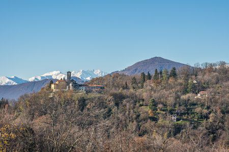 The beautiful rectory and collegiate church of San Vittore in Brezzo di Bedero with Monte Rosa in the backgroundのeditorial素材